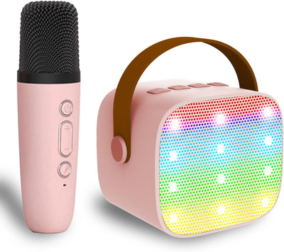 Pink microphone and portable speaker with rainbow lights on a white background